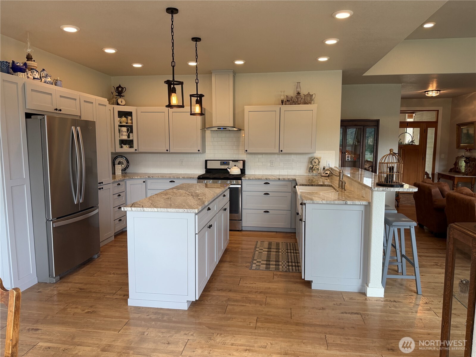 53 Cape Labelle Road Tonasket, WA 98855 - Photo 11 of 40 a kitchen with a sink refrigerator and microwave