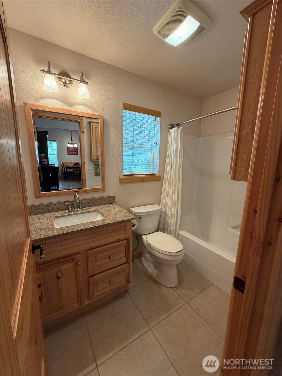 53 Cape Labelle Road Tonasket, WA 98855 - Photo 12 of 40 a bathroom with a toilet sink and mirror