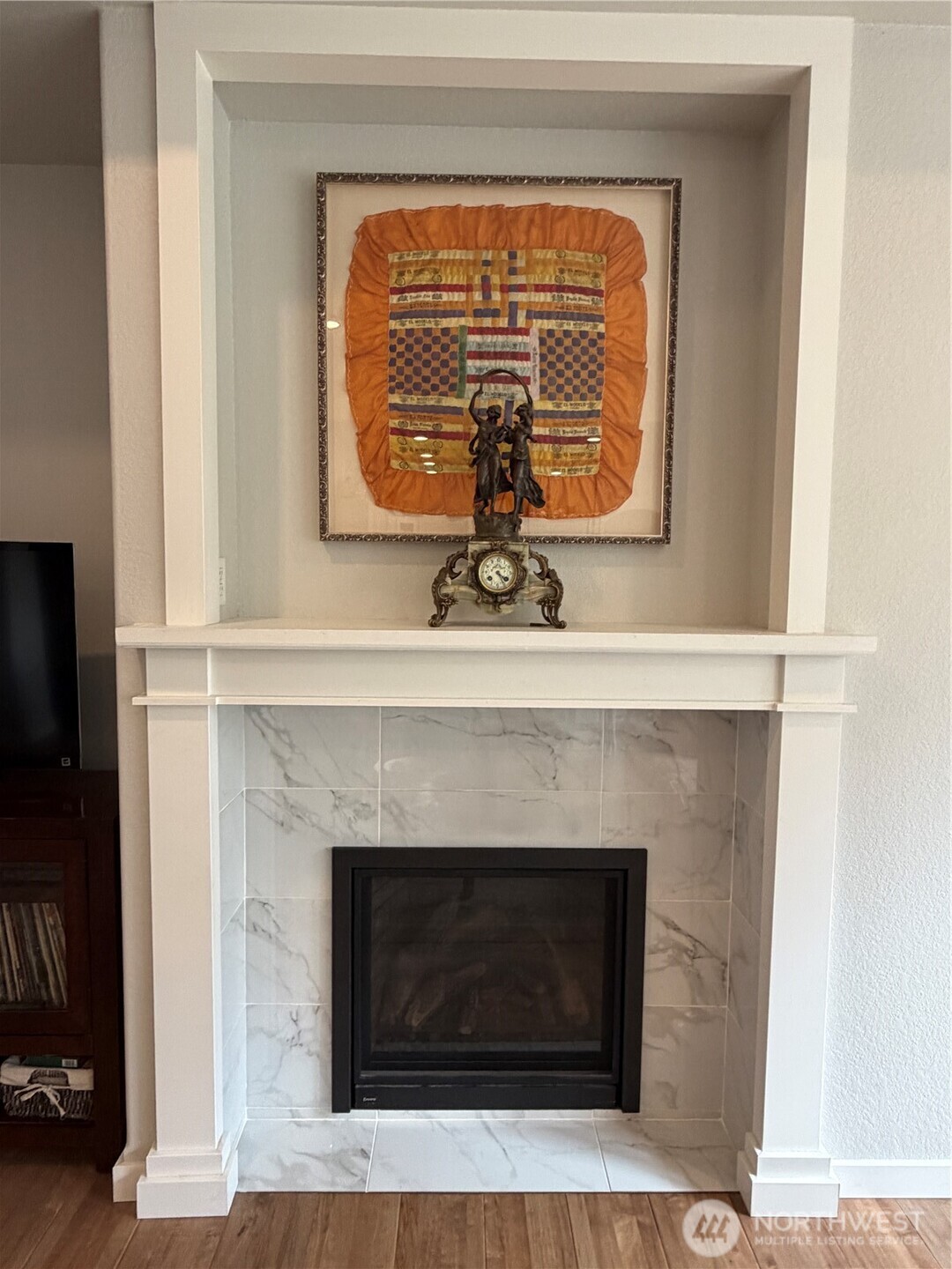 53 Cape Labelle Road Tonasket, WA 98855 - Photo 19 of 40 a living room with a fireplace and a window