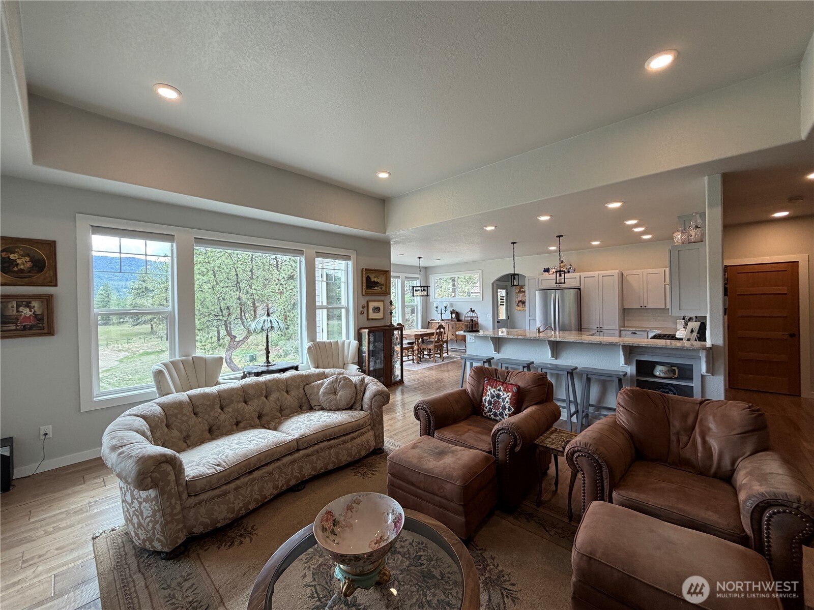 53 Cape Labelle Road Tonasket, WA 98855 - Photo 10 of 40 a living room with furniture and a large window