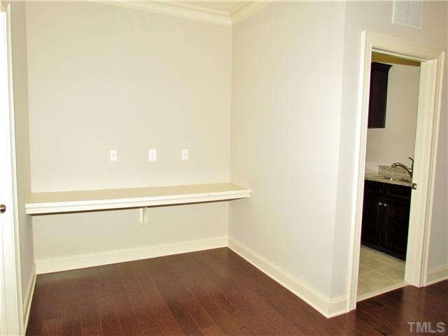 3204 Bryant Falls Court, Unit LOT58 Raleigh, NC 27613 - Photo 15 of 25 a view of an empty room with wooden floor