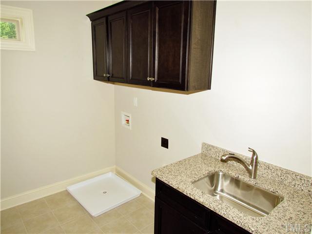 3204 Bryant Falls Court, Unit LOT58 Raleigh, NC 27613 - Photo 17 of 25 a bathroom with a sink and a mirror