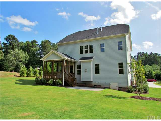 3204 Bryant Falls Court, Unit LOT58 Raleigh, NC 27613 - Photo 25 of 25 a front view of a house with a yard