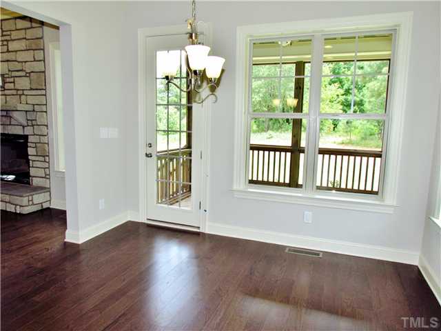 3204 Bryant Falls Court, Unit LOT58 Raleigh, NC 27613 - Photo 10 of 25 a view of an empty room with wooden floor and a window
