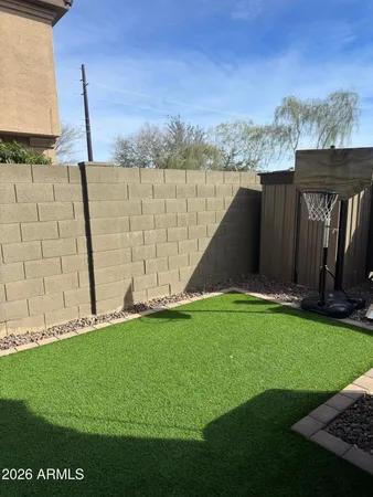 a view of a backyard with a garden and plants