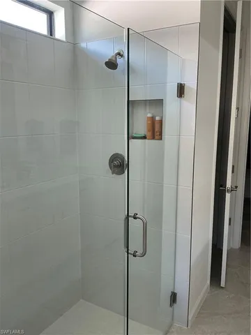 a bathroom with a double vanity sink and mirror