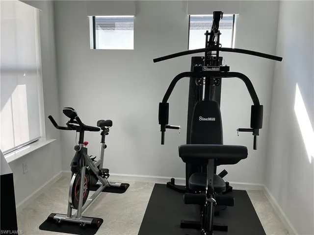 a bathroom with a sink a toilet a mirror and shower