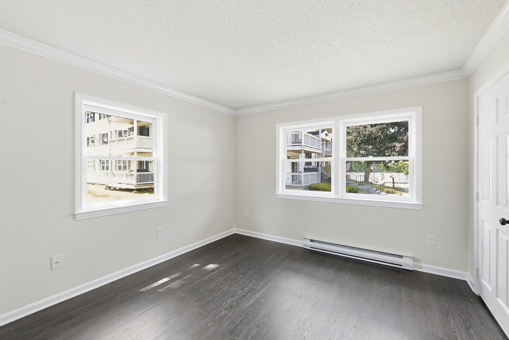 30 Abbey Road, Unit 102 Leominster, MA 01453 - Photo 10 of 15 a view of an empty room with a window