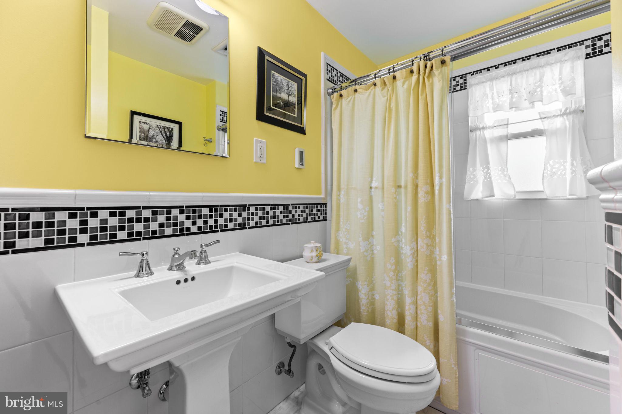 2902 Ritchie Avenue Baltimore, MD 21219 - Photo 28 of 43 a bathroom with a sink toilet and shower