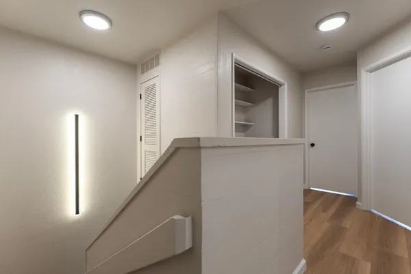 an entryway in a hall with a window