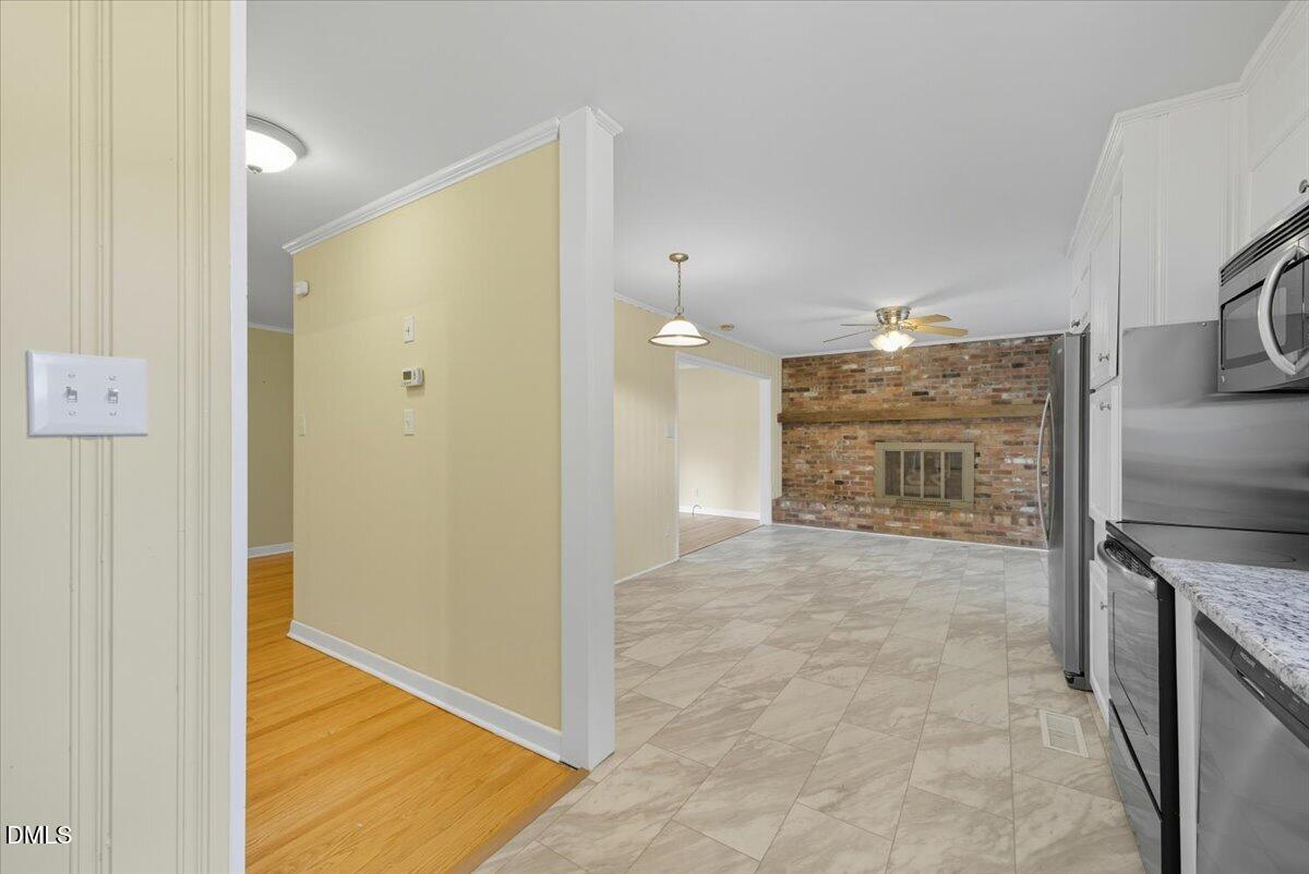 2604 Huntington Road Fayetteville, NC 28303 - Photo 11 of 48 a view of a kitchen with a sink and a refrigerator