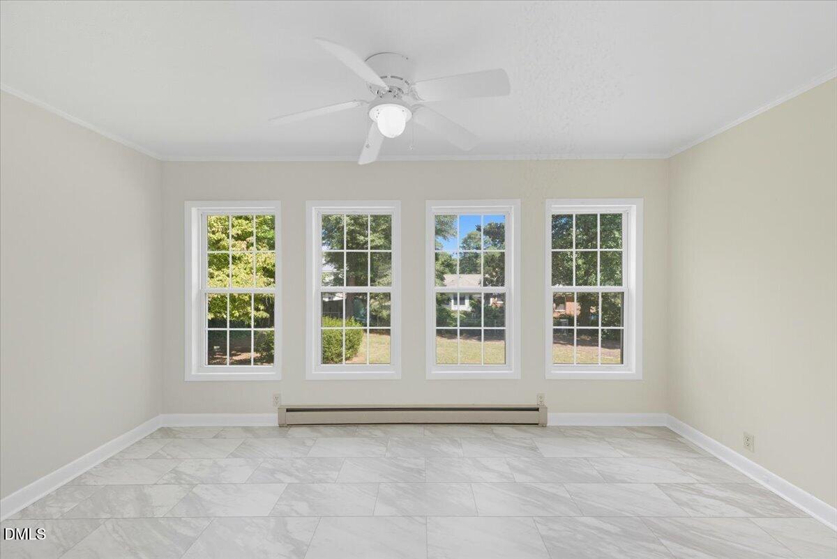 2604 Huntington Road Fayetteville, NC 28303 - Photo 17 of 48 an empty room with windows and entrance