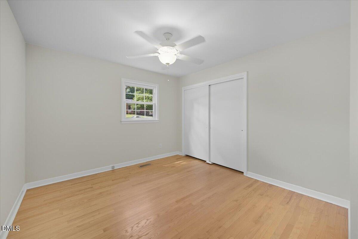 2604 Huntington Road Fayetteville, NC 28303 - Photo 20 of 48 an empty room with a window and a fan