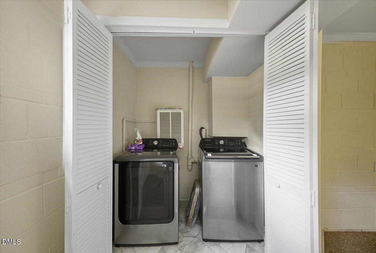 2604 Huntington Road Fayetteville, NC 28303 - Photo 32 of 48 a kitchen with stainless steel appliances granite countertop white cabinets and a refrigerator