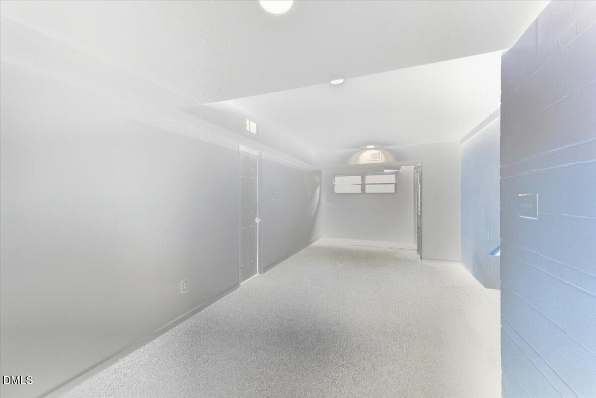 2604 Huntington Road Fayetteville, NC 28303 - Photo 33 of 48 a view of a hallway with a kitchen