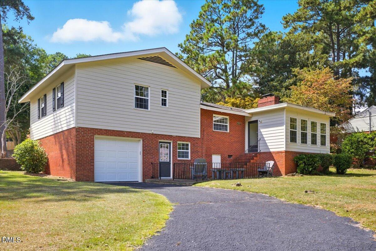 2604 Huntington Road Fayetteville, NC 28303 - Photo 36 of 48 a view of a house with a backyard