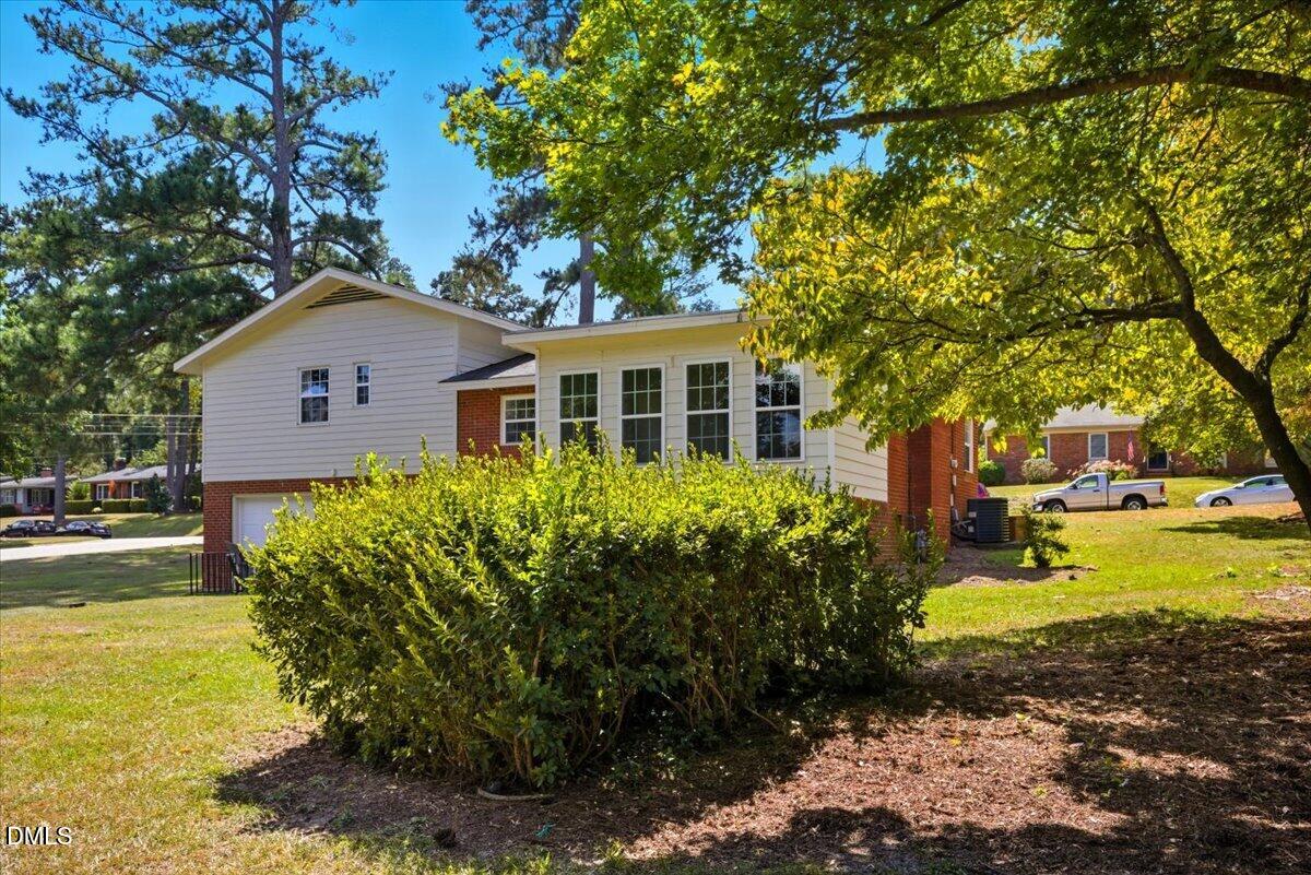 2604 Huntington Road Fayetteville, NC 28303 - Photo 38 of 48 a front view of a house with a garden