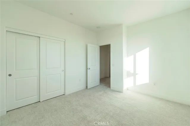 a view of an empty room and a window