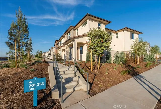 a front view of a house with trees
