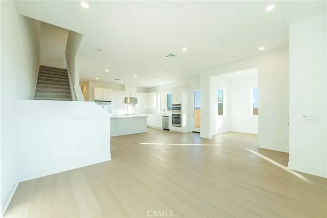 a view of a kitchen with a sink and cabinets