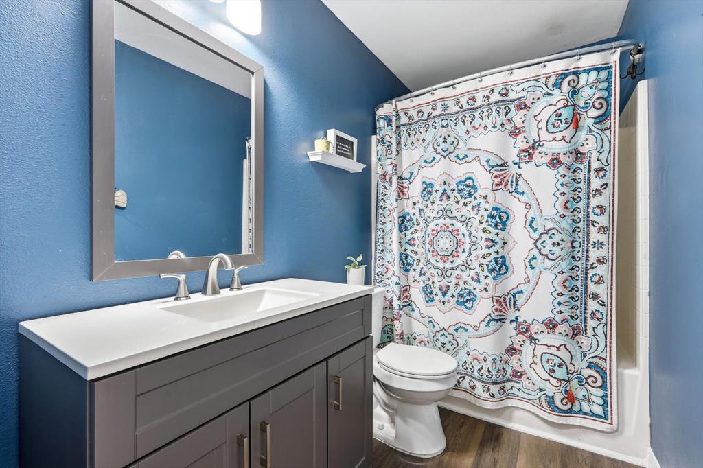 1328 Pierce Road Red Oak, TX 75154 - Photo 20 of 40 Bathroom featuring a gray vanity with a white countertop, undermount sink, and brushed nickel faucet