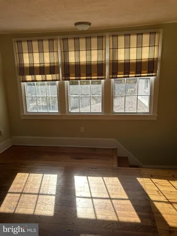 a view of empty room with windows
