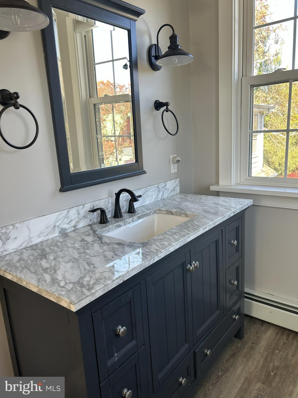 62 Rehill Avenue Elkton, MD 21921 - Photo 22 of 40 a bathroom with a granite countertop sink and a window
