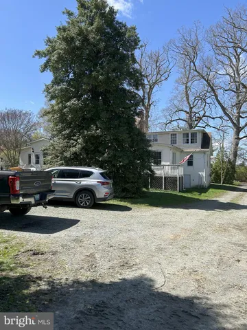 a view of a car park in front of a house