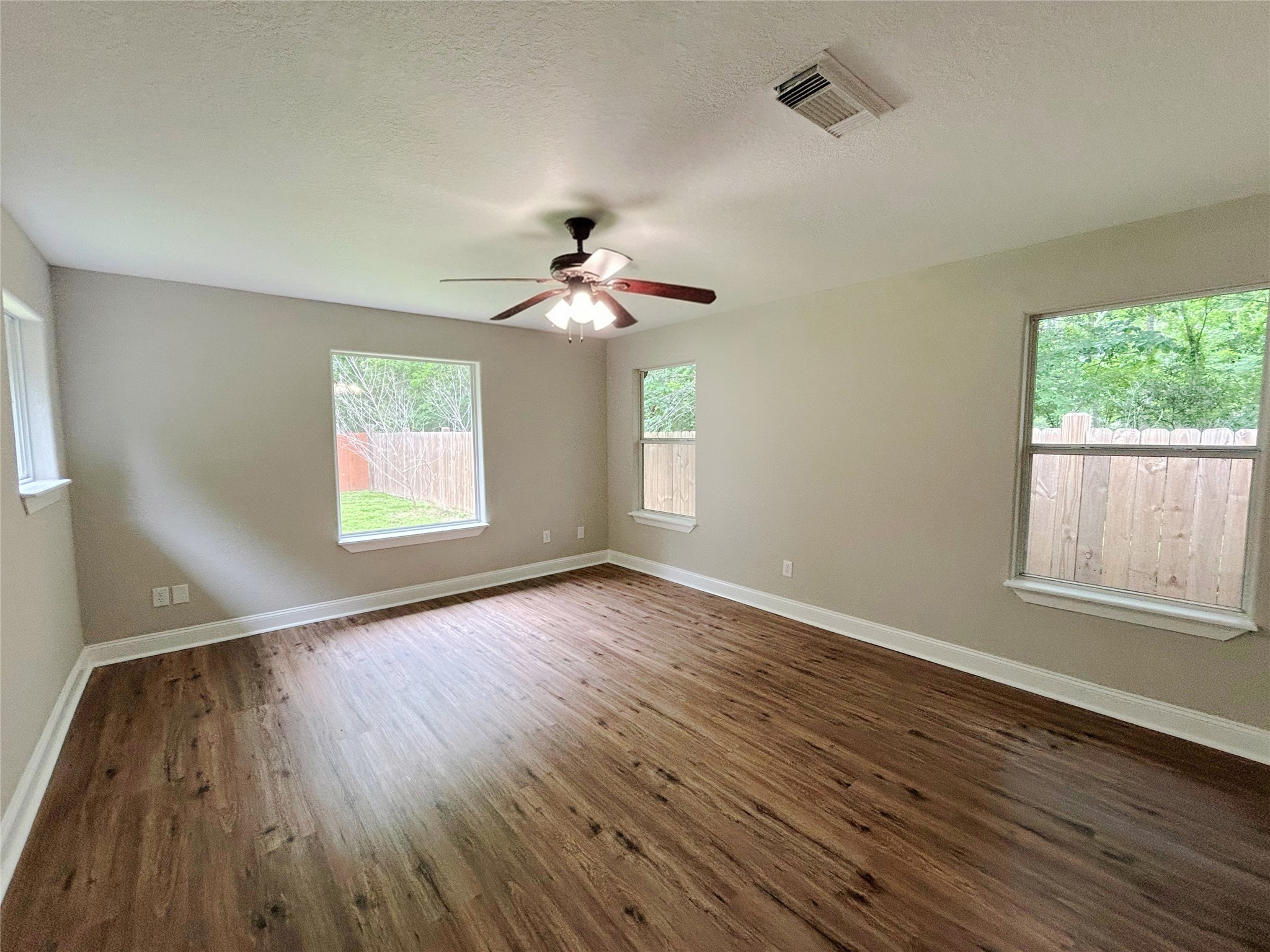 7902 Masters Manvel, TX 77578 - Photo 15 of 21 The light and bright primary bedroom offers plenty of window and wall space.