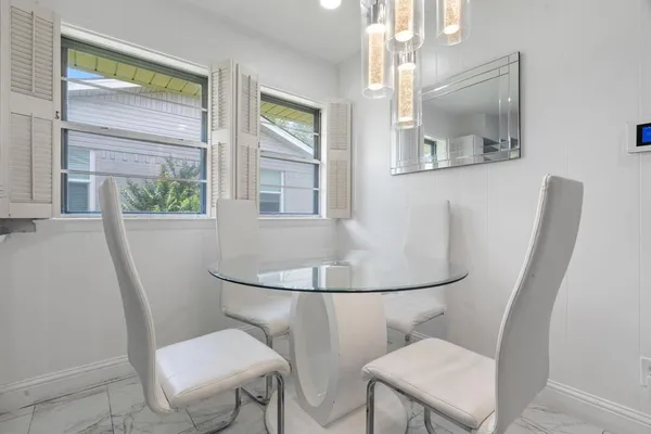 a bathroom with a toilet a sink and a mirror