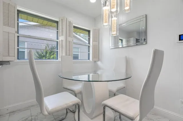 a bathroom with a toilet a sink and a mirror