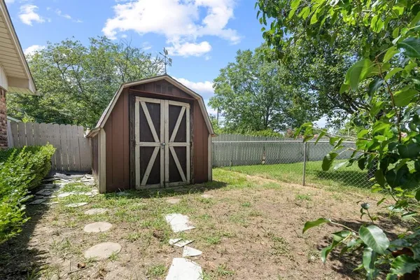 a view of backyard with green space