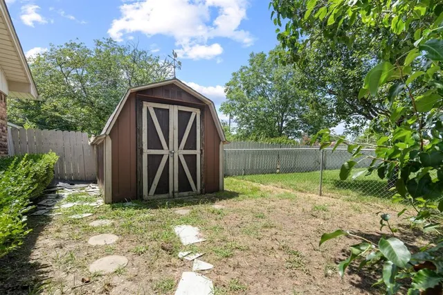 a view of backyard with green space