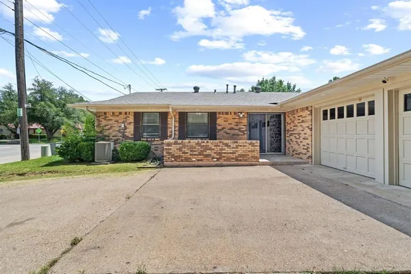a big house with a big yard and large tree