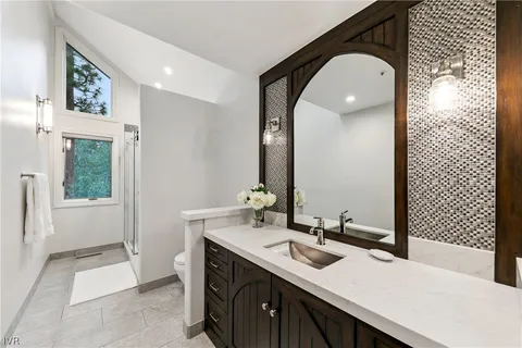 a bathroom with a sink double vanity and a mirror