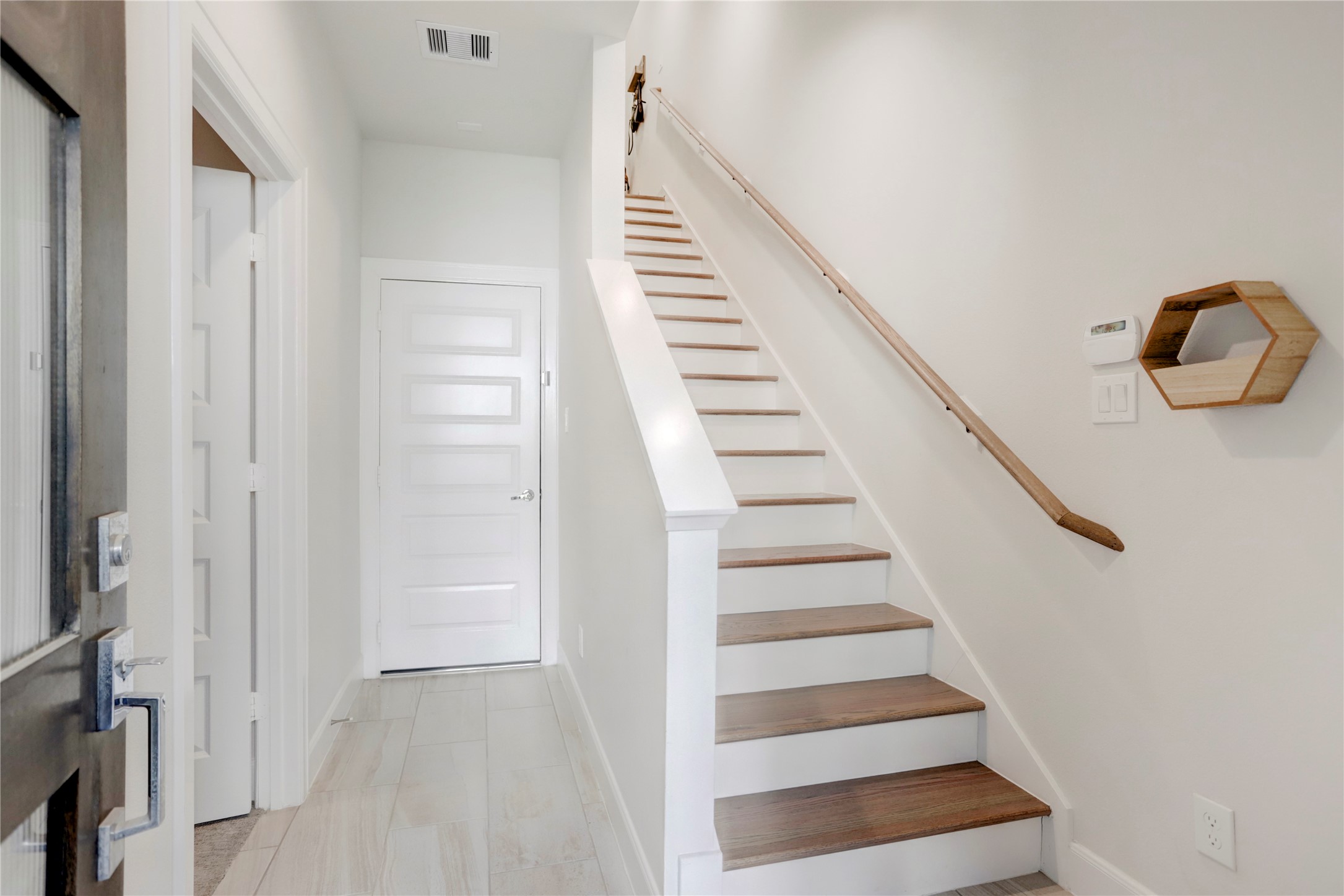 2781 Clinton Drive Houston, TX 77020 - Photo 10 of 12 a view of entryway with wooden floor