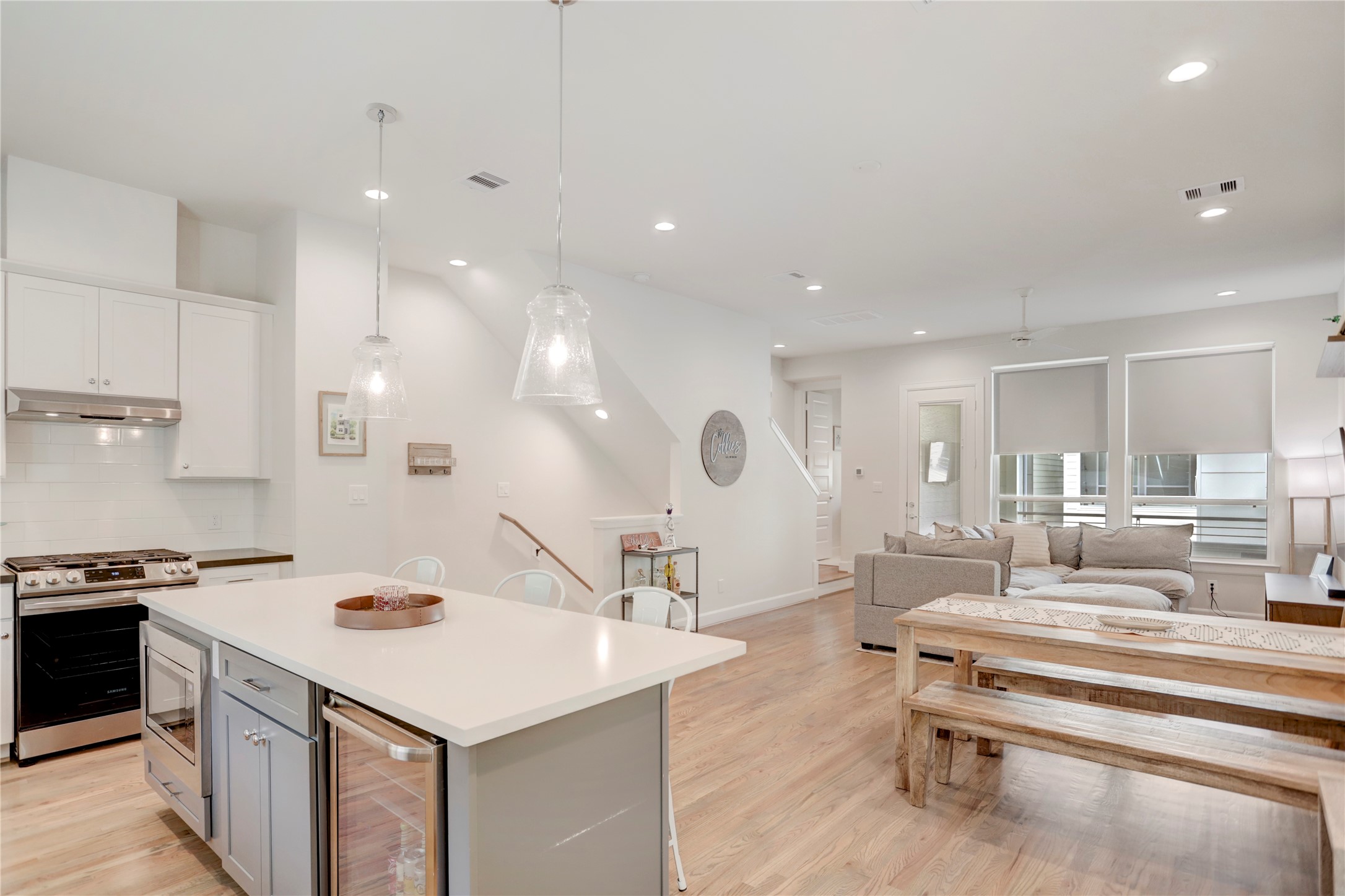 2781 Clinton Drive Houston, TX 77020 - Photo 12 of 12 a living room with kitchen island furniture and a wooden floor
