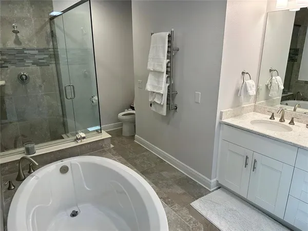 a bathroom with a shower and mirror