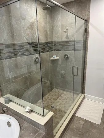 a bedroom with a bed a table and chair