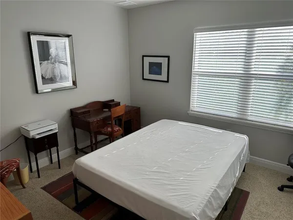 a bathroom with a granite countertop toilet sink and shower