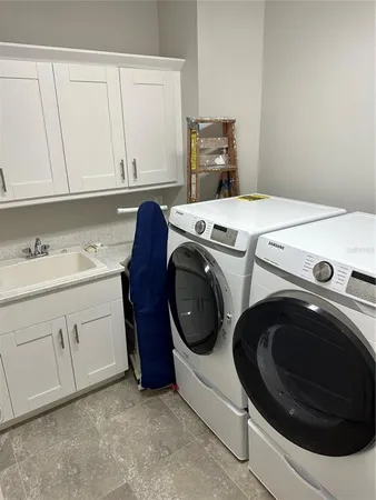 a view of a house with swimming pool and sitting area