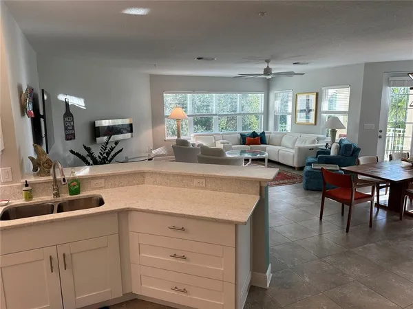 a kitchen with stainless steel appliances granite countertop a sink and a stove