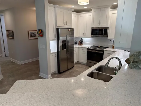a kitchen with sink and window