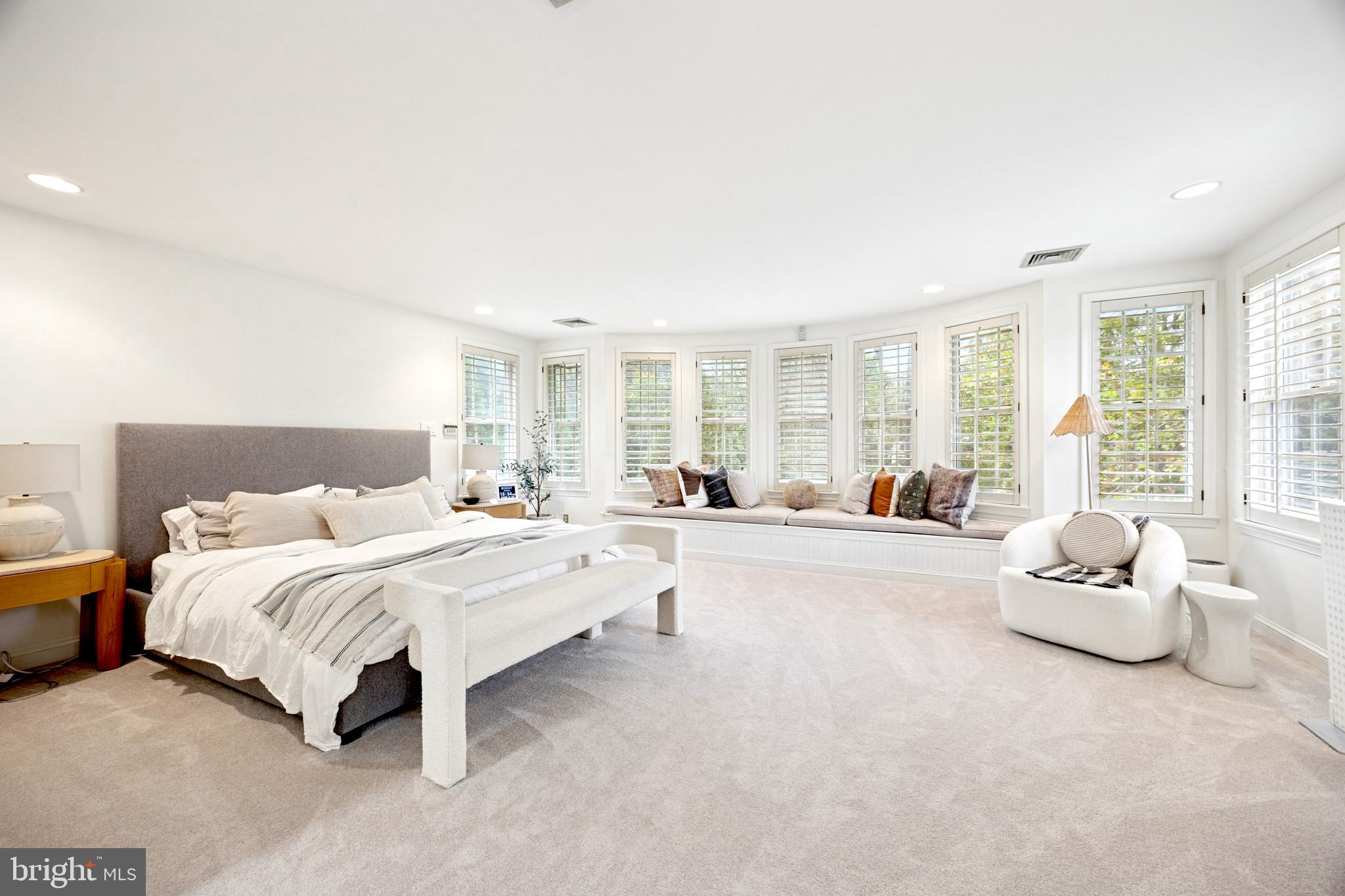 1726 Riverview Road Gladwyne, PA 19035 - Photo 12 of 38 a spacious bedroom with a bed and large windows
