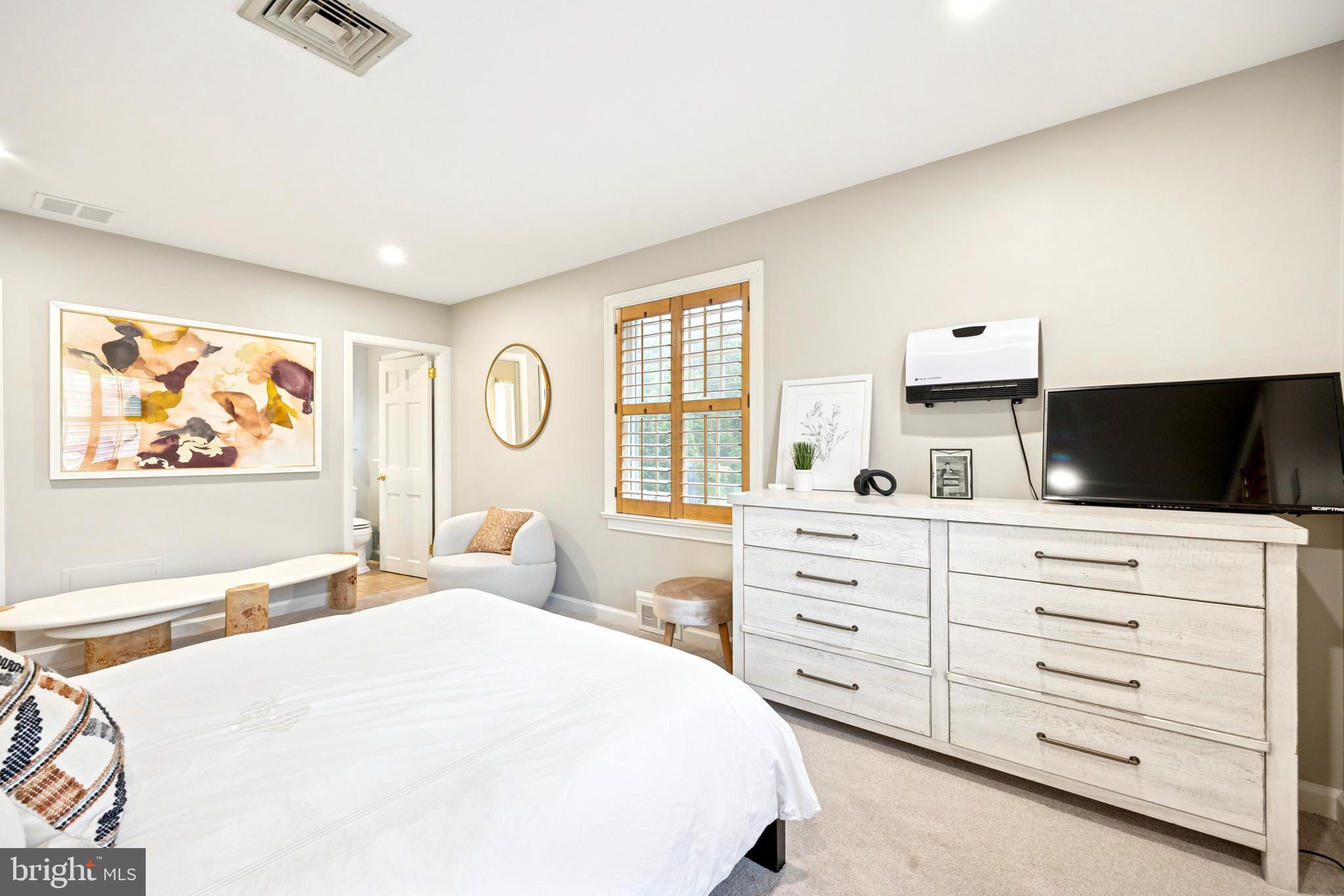 1726 Riverview Road Gladwyne, PA 19035 - Photo 16 of 38 a bedroom with a bed and a flat screen tv