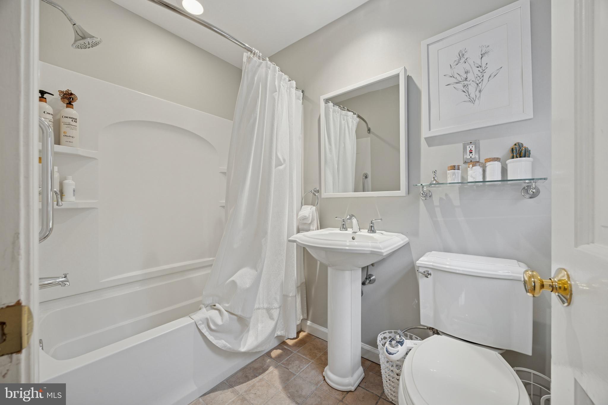 1726 Riverview Road Gladwyne, PA 19035 - Photo 18 of 38 a white toilet sitting next to a bathroom sink