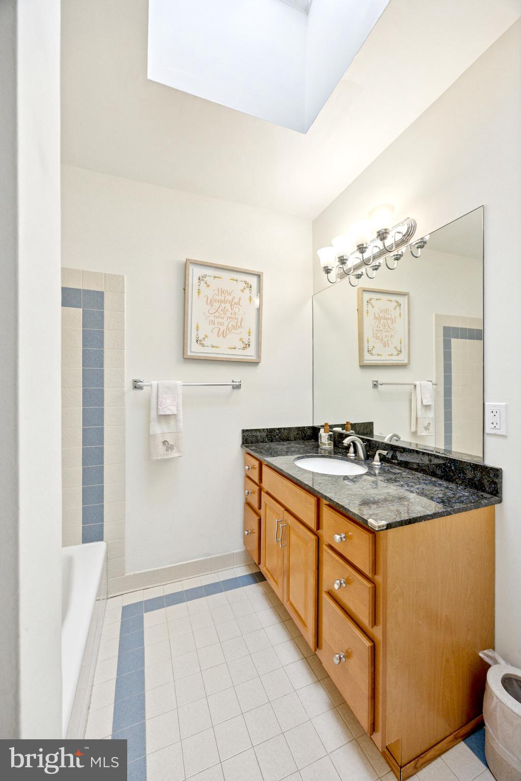 1726 Riverview Road Gladwyne, PA 19035 - Photo 22 of 38 a bathroom with a granite countertop sink a mirror and a