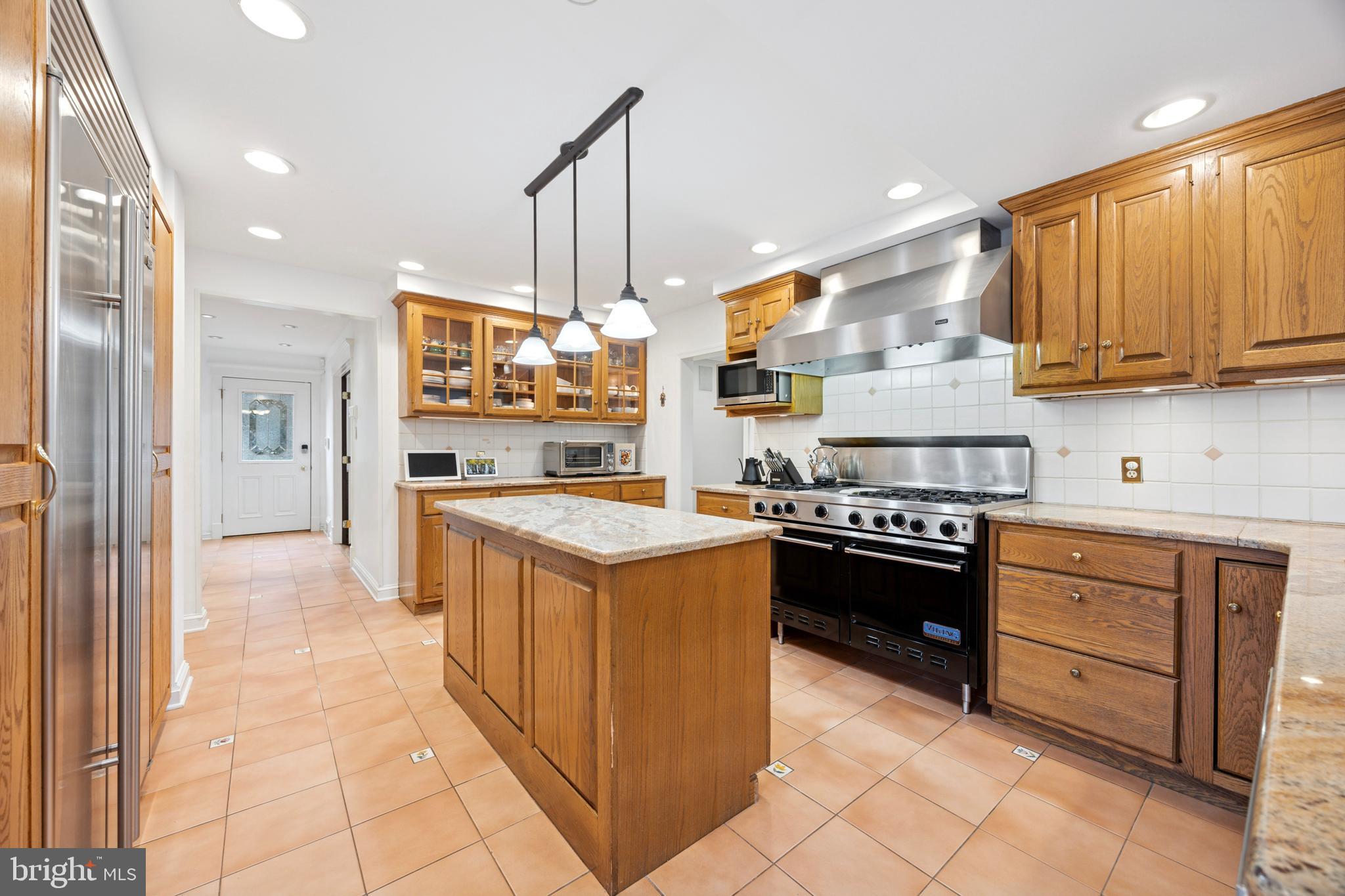 1726 Riverview Road Gladwyne, PA 19035 - Photo 4 of 38 a kitchen with stainless steel appliances granite countertop a stove a sink and a refrigerator
