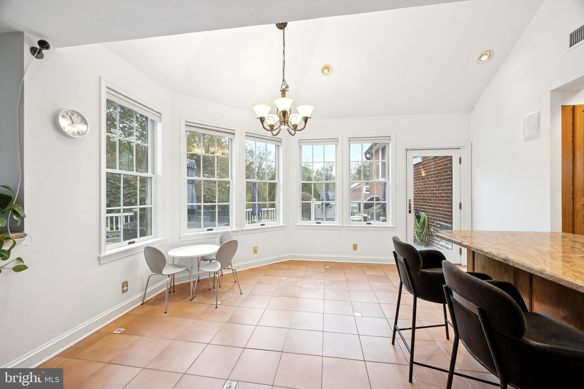 1726 Riverview Road Gladwyne, PA 19035 - Photo 5 of 38 a living room with a large window couches and chandelier