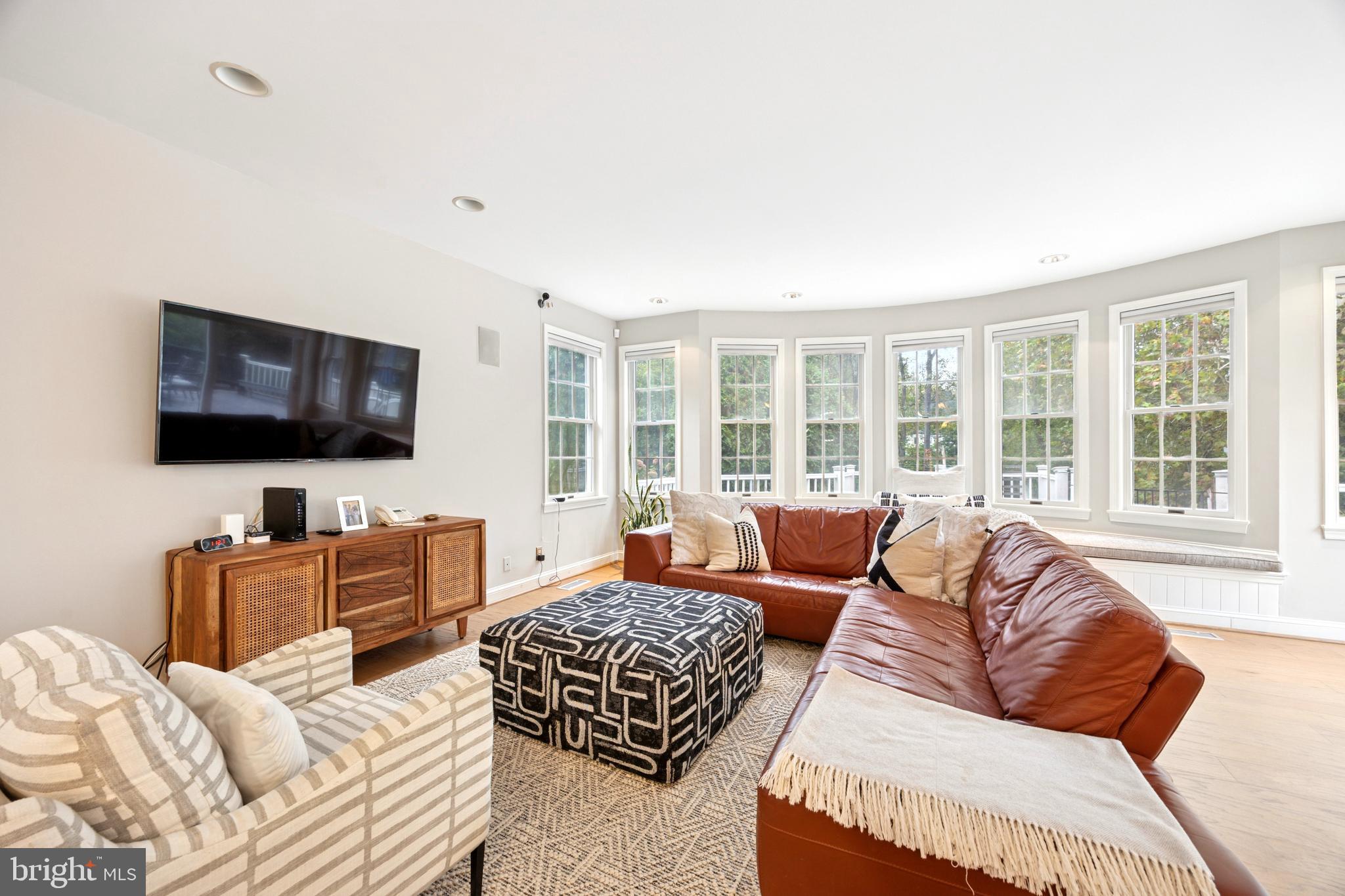 1726 Riverview Road Gladwyne, PA 19035 - Photo 7 of 38 a living room with furniture and a flat screen tv